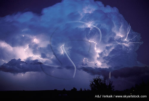 Rare twilight thunderhead with various forms of lightning