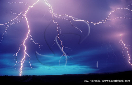 Exquisitely detailed lightning strikes in a turquoise and purple sky 