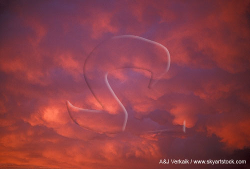 A rosy sunset transforms a stormy Mammatus sky