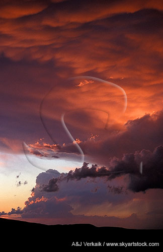 Enchantment and drama in a surreal stormy sunset sky