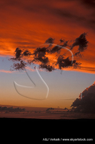 Abstract cloudscape: surreal twilight with orange storm cloud