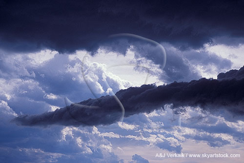 Strange sights in the sky: a dark tail cloud dangles menacingly