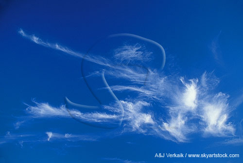 Carefree streaks and tufts of cloud dancing with exuberance