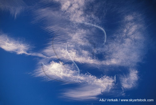 Joyous bursts of cloud detail in a deep blue sky abstract