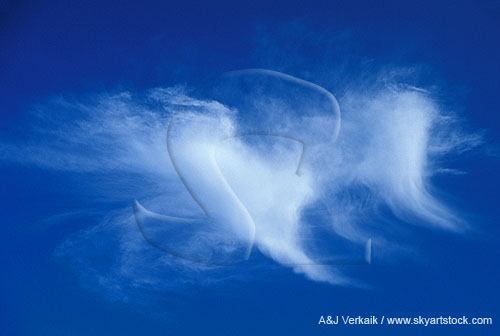 Two cloud spikes: long, curving trails of falling ice crystals