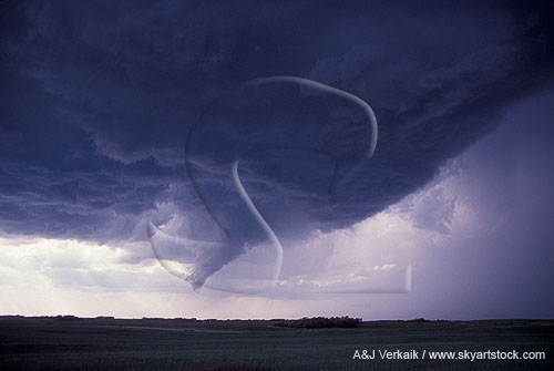 The updraft base of a storm with a funnel cloud hanging down