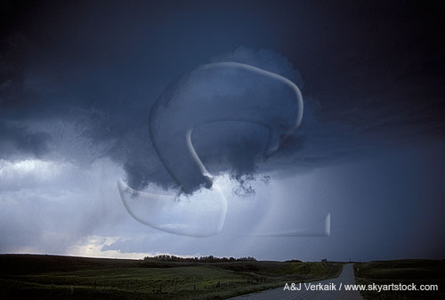 A cloud rotates as it joins into a storm