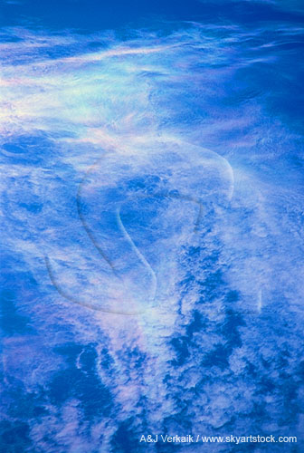 Rippling threads of cloud shimmer with subtle iridescence
