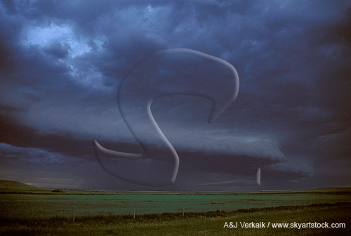 A shelf cloud stands out as a light line in the midst of black clouds