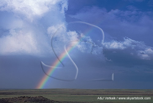 Hope dawns as a lucky rainbow arcs through stormy clouds