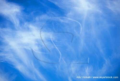 Sky texture abstract: wispy fallstreaks weave a veil across the sky