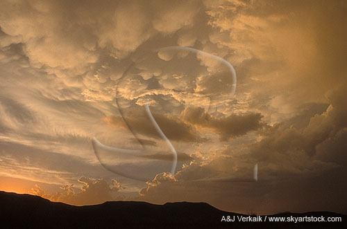 Abstract: silver and gold cloud texture adds mystery to a sunset