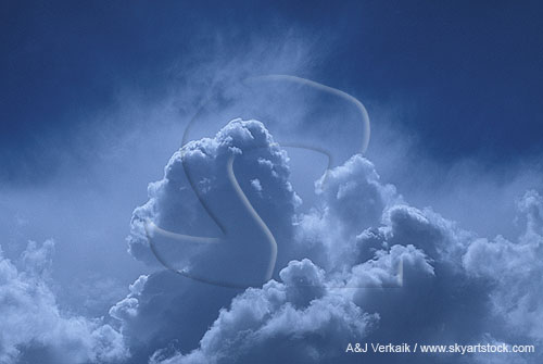 Aerial of heavenly clouds as shaded towers spurt up into a misty sky