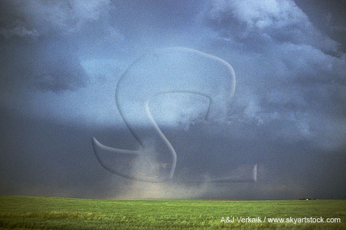 A tornado vortex made visible by its debris cloud (column of dirt)
