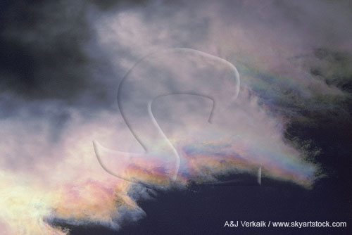 The colors of iridescence on the brushed edge of a wave cloud