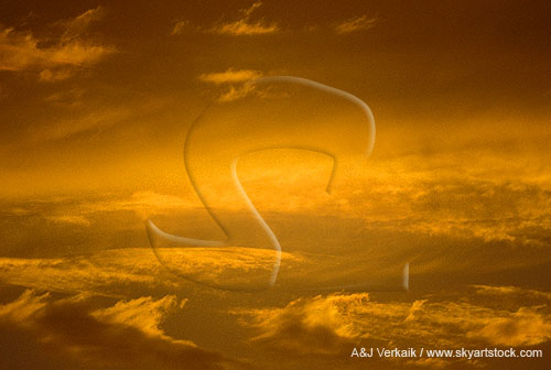 Golden sunset abstract with wispy cloud