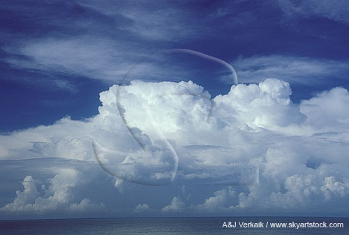Boiling cloud bank of tropical thunderheads over ocean