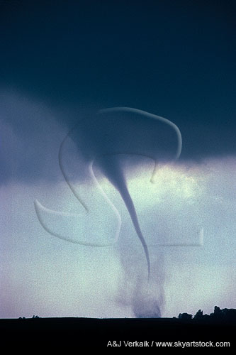 Slender tornado with debris cloud column