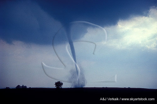 Slender tornado, stirring up dirt