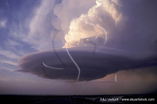 This laminar storm base has a wall cloud shaped like a flying saucer