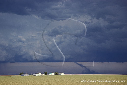 Storm with a tornado on its dark updraft base