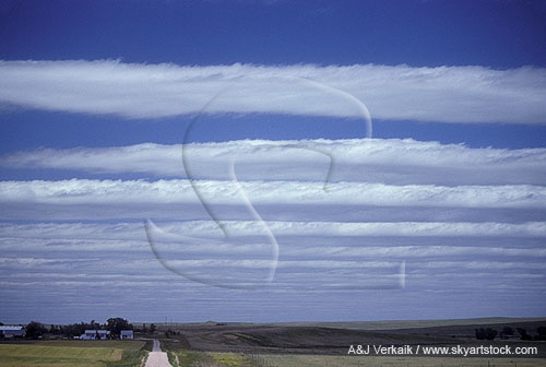 Clouds arranged in parallel bands by a lee wave pattern