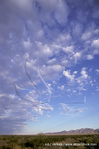 Bubbly silver clouds spread and scatter