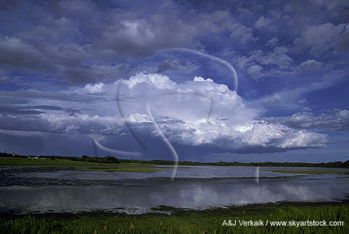 Meditative cloudscape with reflection lending a sense of harmony