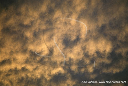 Golden Mammatus clouds with a rough, irregular, brushy texture