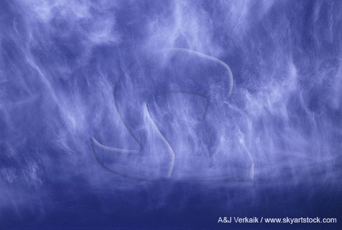 Streaky wisps of cloud veil the sky