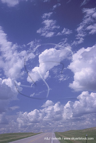 Cumulus cloud evaporating to reveal a shear funnel