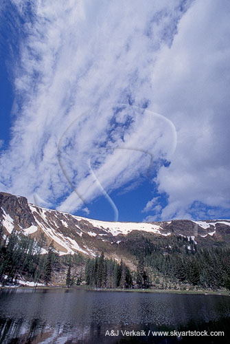 Cloud streaks and spears in pure blue sky