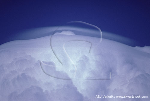 Thin, new Pileus cloud compressed by the flow above