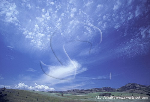 Silvery clouds scatter to the winds in a skyscape bursting with creativity