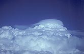 Pileus clouds top a storm’s crown in this aerial photo