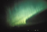 Eerie green rays in an arc of Aurora Borealis (northern lights)