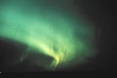 A soft eerie swirl of green Aurora Borealis (northern lights)