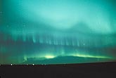 Awe-inspiring striated layered curtains of Aurora Borealis