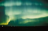 Eerie green curtains of striated Aurora Borealis