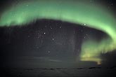 Awe-inspiring arc of northern lights (Aurora Borealis) in the arctic