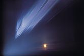 A mysterious light streak in the arctic with full moon