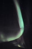 A mysterious curved band of northern lights (Aurora Borealis).