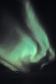 A flickering green flame of northern lights 
