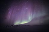 Purple drapery with green bands in an arctic northern lights display