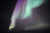 Bright swords of purple and green northern lights (Aurora Borealis)