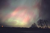 Ghostly patches of pink and green northern lights (Aurora Borealis)