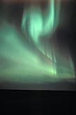 A folded drapery of green northern lights