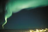 A wavy band of bright green northern lights
