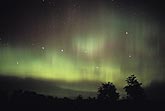 Haunting patches and streaks of green northern lights 