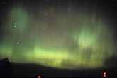 Patches and streaks in a curtain of green northern lights 